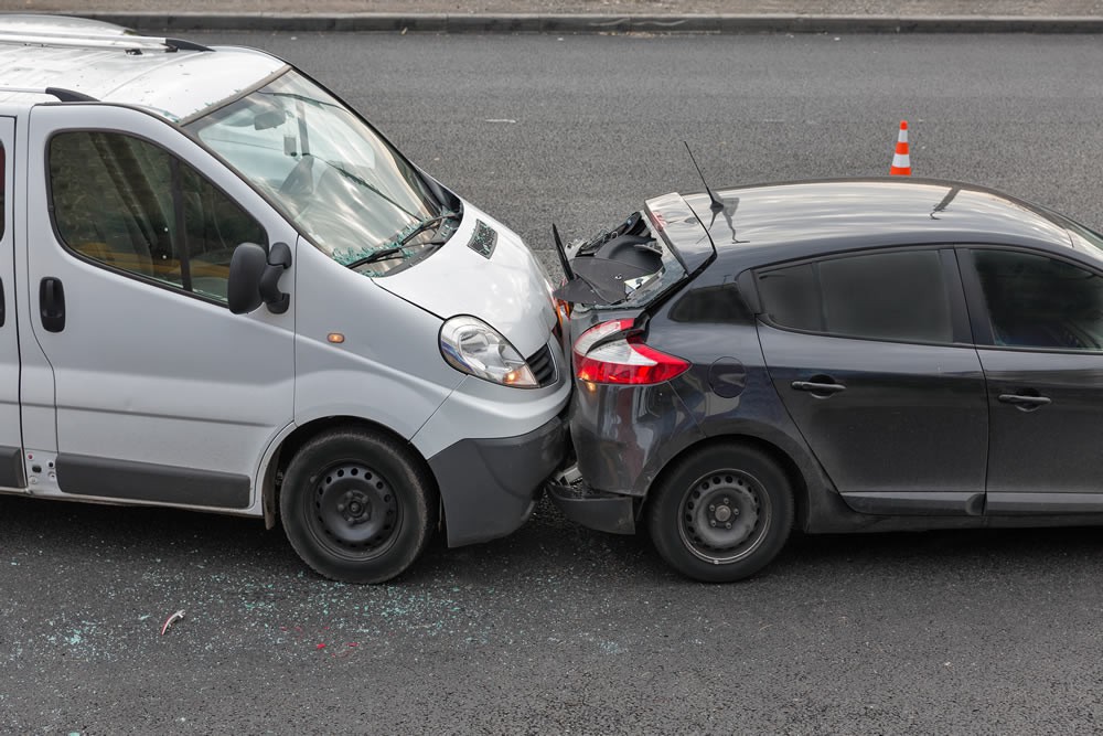 $585,000.00 – For a middle aged woman whose vehicle was struck in the rear which caused her spinal injuries