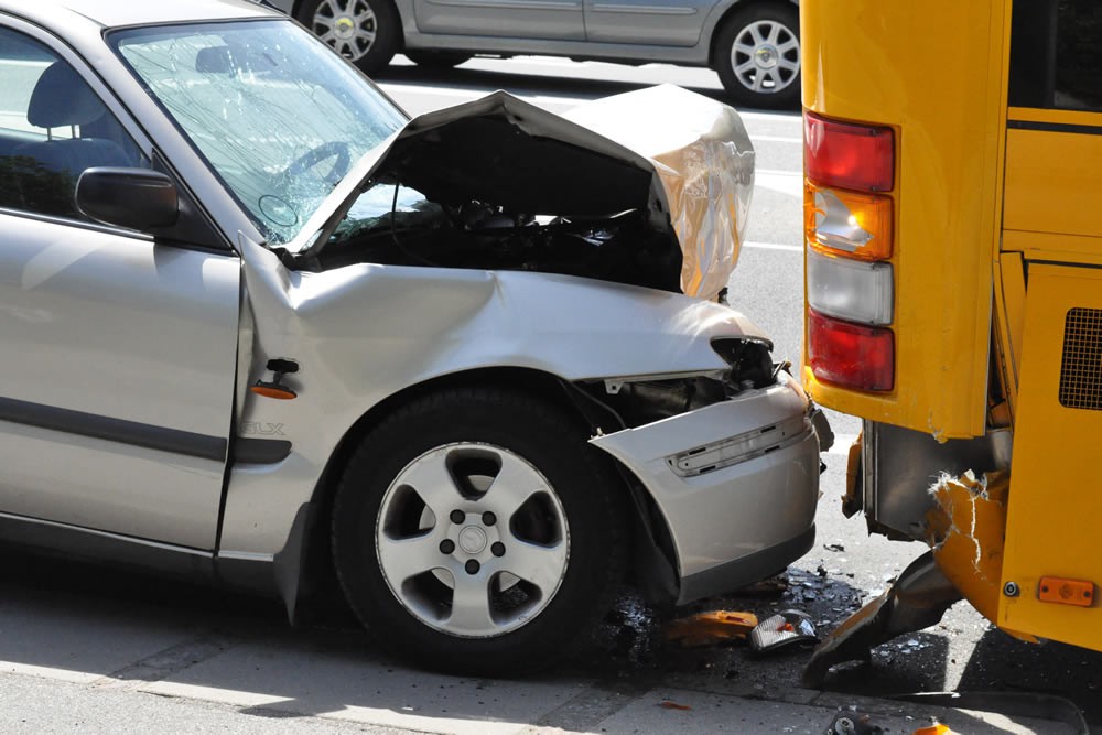 $400,000.00 – For a man whose car collided with a bus and suffered an injury to his knee which required surgery